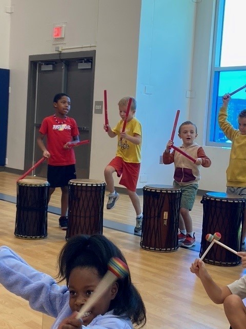 Students playing drums.