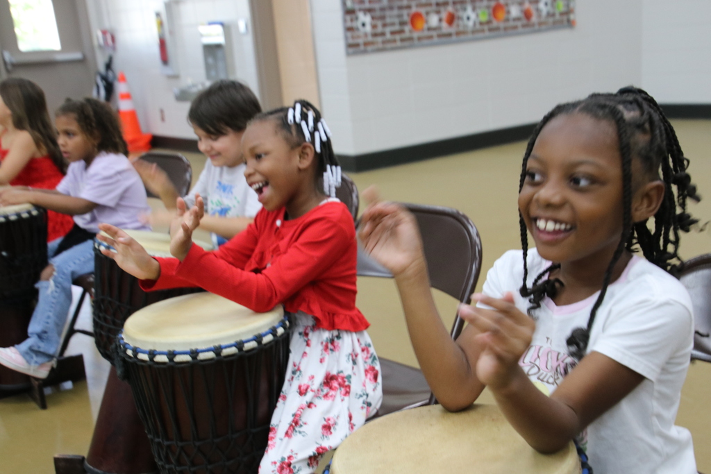 Drumming Up Character!    This past Tuesday, our students enjoyed School Drum Day!  Mr. Steve at Dancing Drum led our students through rhythms and songs about fairness, responsibility, teamwork, and caring for others.    It was truly a "drum"-atic event with fun had by all!  To contribute to the Dancing Drum Program and support future musical events at our school, please visit the School Window payment platform our website and scroll within the MUSIC/CHORUS category.