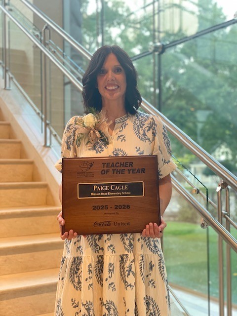 Our teacher of the year smiling for a picture at the Teacher of the Year banquet.