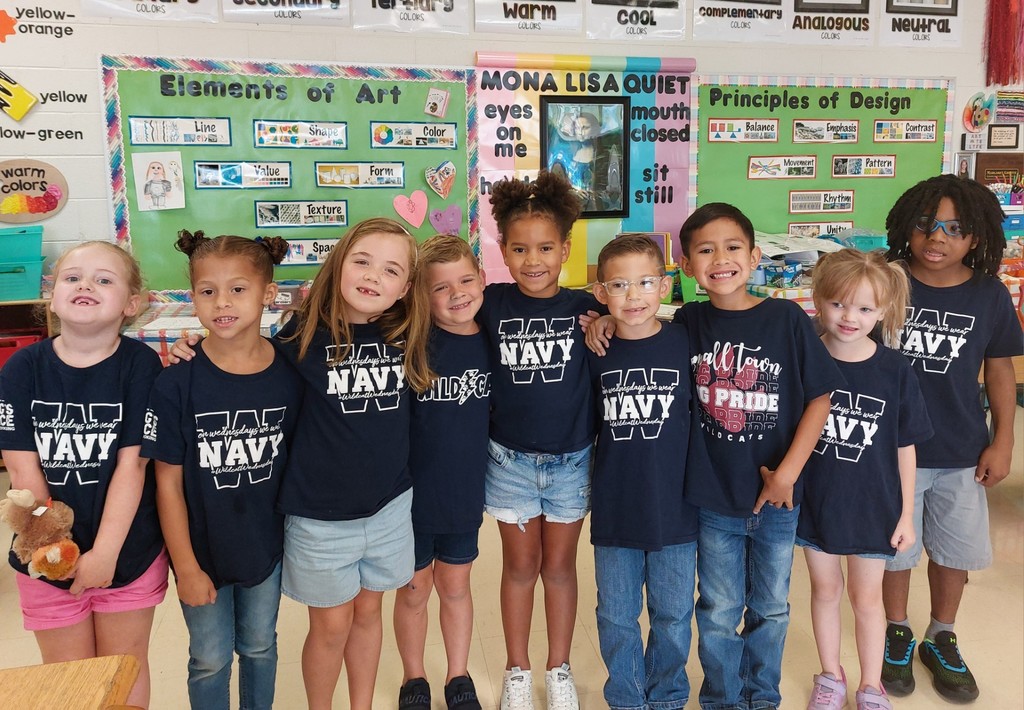 group of students wearing Wildcat navy shirts
