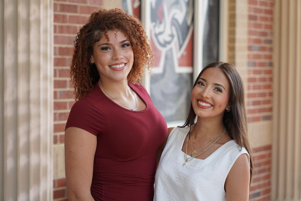 two Woodland High School students posing outside of building