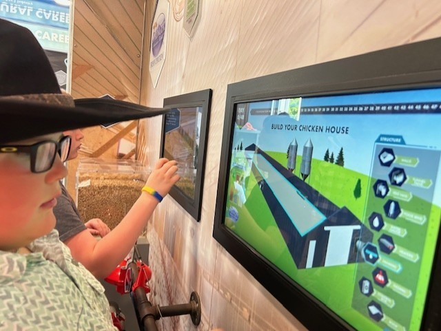 Our 3–5 students had an exciting visit from Georgia Farm Bureau and their mobile Georgia Ag Experience!  This 36-foot mobile classroom showcases Georgia agriculture on the road, visiting elementary schools and community organizations across the state. Inside, students explored seven different Georgia agricultural commodities through technology and digital learning.   The Georgia Ag Experience is a STEM-based program that invites students across Georgia to discover the vast opportunities in agriculture. It connects science, technology, and real-world farming in a way that brings learning to life for our students and helps them think about possible future careers in the agricultural field, from farming and animal science to technology and engineering.   A special shoutout to Gaines Beef for joining us with the Ag Mobile. They also partner with our School Nutrition team to provide fresh beef to our schools, and we are so grateful for their support.