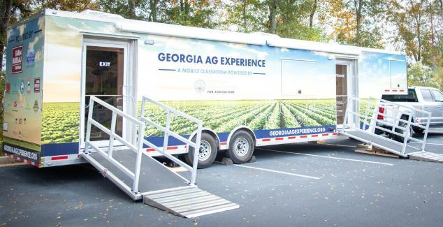 Our 3–5 students had an exciting visit from Georgia Farm Bureau and their mobile Georgia Ag Experience!  This 36-foot mobile classroom showcases Georgia agriculture on the road, visiting elementary schools and community organizations across the state. Inside, students explored seven different Georgia agricultural commodities through technology and digital learning.   The Georgia Ag Experience is a STEM-based program that invites students across Georgia to discover the vast opportunities in agriculture. It connects science, technology, and real-world farming in a way that brings learning to life for our students and helps them think about possible future careers in the agricultural field, from farming and animal science to technology and engineering.   A special shoutout to Gaines Beef for joining us with the Ag Mobile. They also partner with our School Nutrition team to provide fresh beef to our schools, and we are so grateful for their support.
