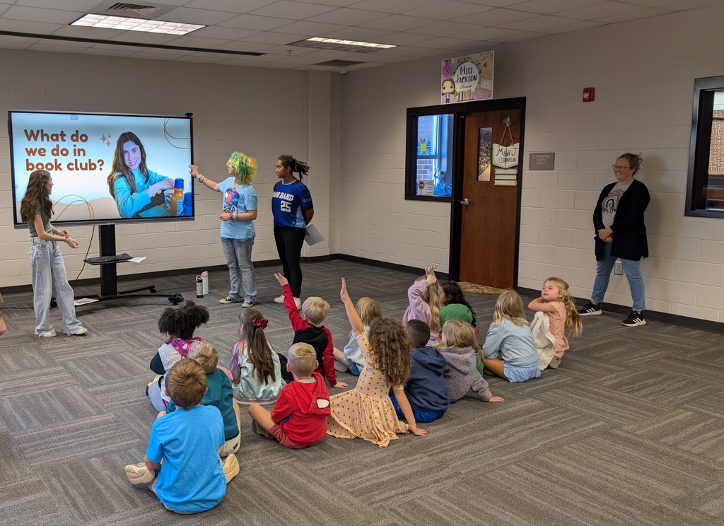 📚✨ Our 1st grade students wrapped up Module One of our new Tier 1 curriculum, Arts and Letters, with a very special “bookend” activity at Cass High School’s Media Center!  Students explored the joy of reading through fun, hands-on stations: 📖 Library & Read Aloud – Listening to The Book With No Pictures by BJ Novak 📚 Book Care – Learning how to take care of books and watching a Colibri machine in action 👥 Book Club – Meeting high school book club members, hearing about their love for reading, and playing “This or That – Reading Edition” 🎨 Bookmarks & Photo Booth – Creating their own bookmarks and taking fun group/solo photos 🖥️ Circulation Desk Tour – Guided by library interns with a special surprise along the way!  To finish the day, our students proudly took the “Reading Warrior” pledge and received a pin and certificate—reminders of the lifelong gift of books and the joy of reading at every age. 💛  We are so proud of our young readers and thankful to Cass High for hosting this memorable experience! 🌟📚