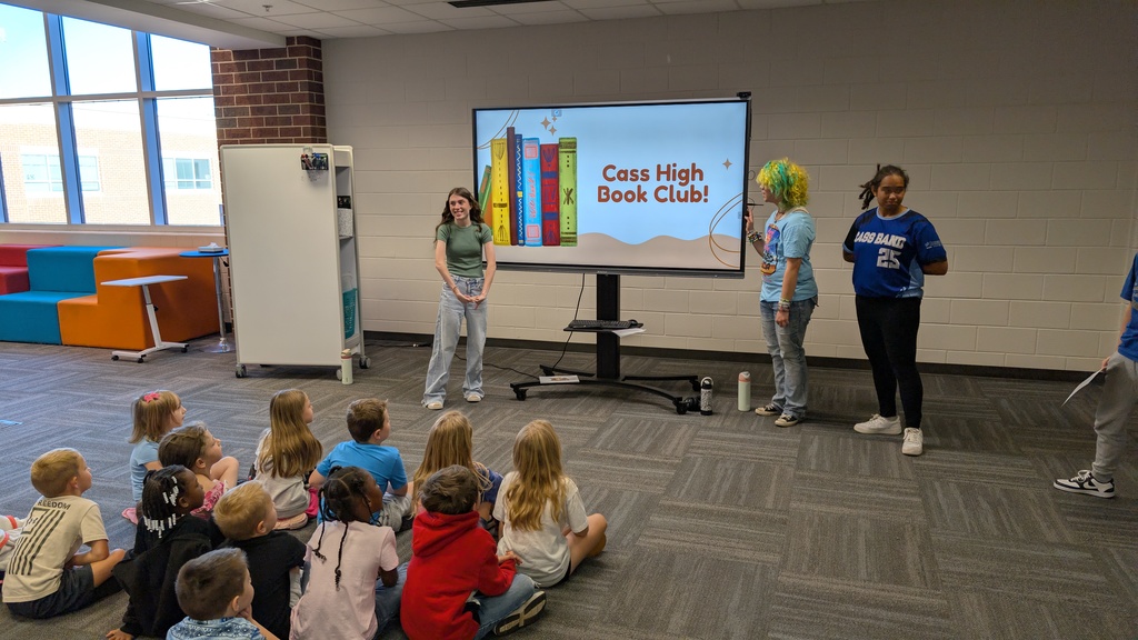 📚✨ Our 1st grade students wrapped up Module One of our new Tier 1 curriculum, Arts and Letters, with a very special “bookend” activity at Cass High School’s Media Center!  Students explored the joy of reading through fun, hands-on stations: 📖 Library & Read Aloud – Listening to The Book With No Pictures by BJ Novak 📚 Book Care – Learning how to take care of books and watching a Colibri machine in action 👥 Book Club – Meeting high school book club members, hearing about their love for reading, and playing “This or That – Reading Edition” 🎨 Bookmarks & Photo Booth – Creating their own bookmarks and taking fun group/solo photos 🖥️ Circulation Desk Tour – Guided by library interns with a special surprise along the way!  To finish the day, our students proudly took the “Reading Warrior” pledge and received a pin and certificate—reminders of the lifelong gift of books and the joy of reading at every age. 💛  We are so proud of our young readers and thankful to Cass High for hosting this memorable experience! 🌟📚