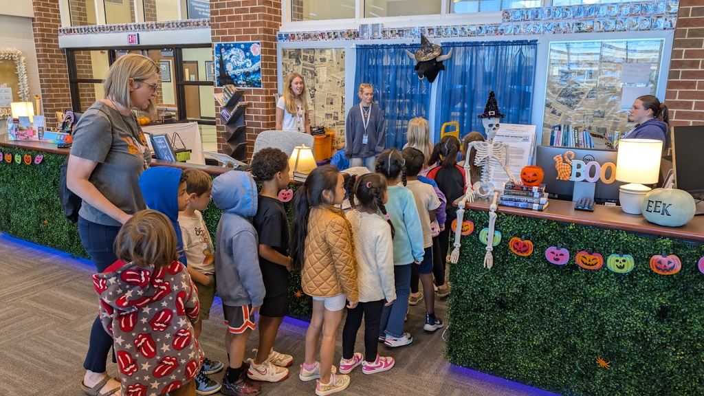 📚✨ Our 1st grade students wrapped up Module One of our new Tier 1 curriculum, Arts and Letters, with a very special “bookend” activity at Cass High School’s Media Center!  Students explored the joy of reading through fun, hands-on stations: 📖 Library & Read Aloud – Listening to The Book With No Pictures by BJ Novak 📚 Book Care – Learning how to take care of books and watching a Colibri machine in action 👥 Book Club – Meeting high school book club members, hearing about their love for reading, and playing “This or That – Reading Edition” 🎨 Bookmarks & Photo Booth – Creating their own bookmarks and taking fun group/solo photos 🖥️ Circulation Desk Tour – Guided by library interns with a special surprise along the way!  To finish the day, our students proudly took the “Reading Warrior” pledge and received a pin and certificate—reminders of the lifelong gift of books and the joy of reading at every age. 💛  We are so proud of our young readers and thankful to Cass High for hosting this memorable experience! 🌟📚