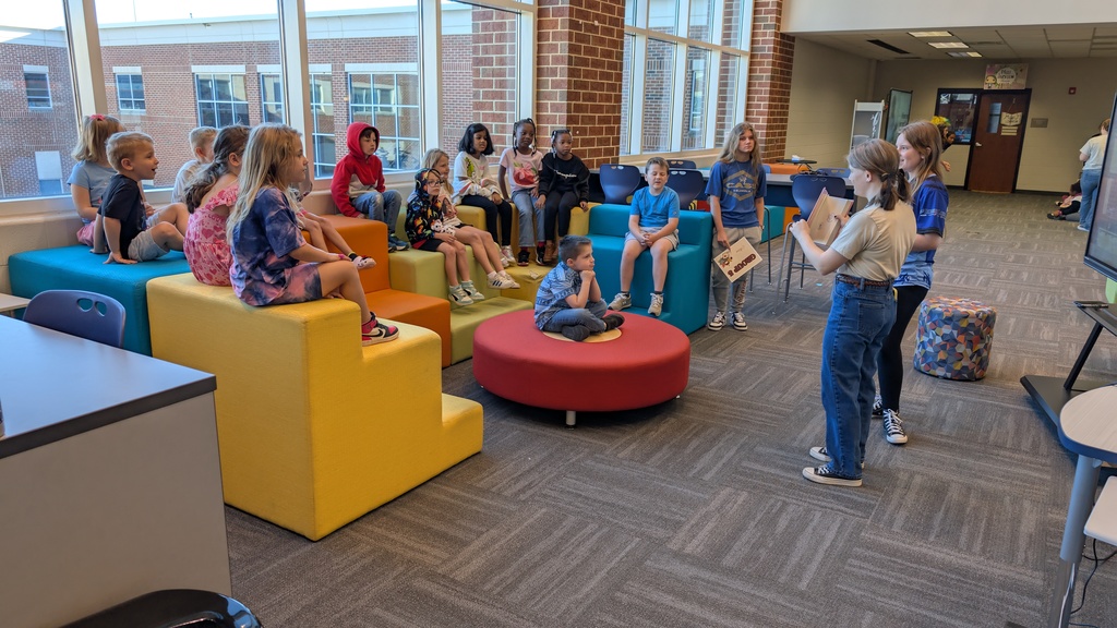 📚✨ Our 1st grade students wrapped up Module One of our new Tier 1 curriculum, Arts and Letters, with a very special “bookend” activity at Cass High School’s Media Center!  Students explored the joy of reading through fun, hands-on stations: 📖 Library & Read Aloud – Listening to The Book With No Pictures by BJ Novak 📚 Book Care – Learning how to take care of books and watching a Colibri machine in action 👥 Book Club – Meeting high school book club members, hearing about their love for reading, and playing “This or That – Reading Edition” 🎨 Bookmarks & Photo Booth – Creating their own bookmarks and taking fun group/solo photos 🖥️ Circulation Desk Tour – Guided by library interns with a special surprise along the way!  To finish the day, our students proudly took the “Reading Warrior” pledge and received a pin and certificate—reminders of the lifelong gift of books and the joy of reading at every age. 💛  We are so proud of our young readers and thankful to Cass High for hosting this memorable experience! 🌟📚