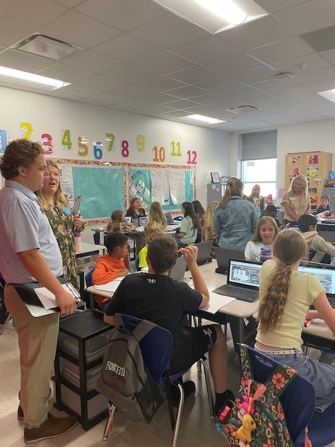 Students working on their STEM project and sharing ideas with each other.