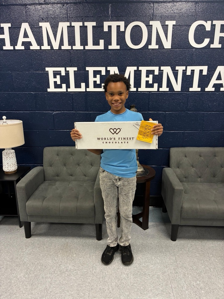 Savon found the golden ticket in his box of chocolates. He won this huge chocolate bar.