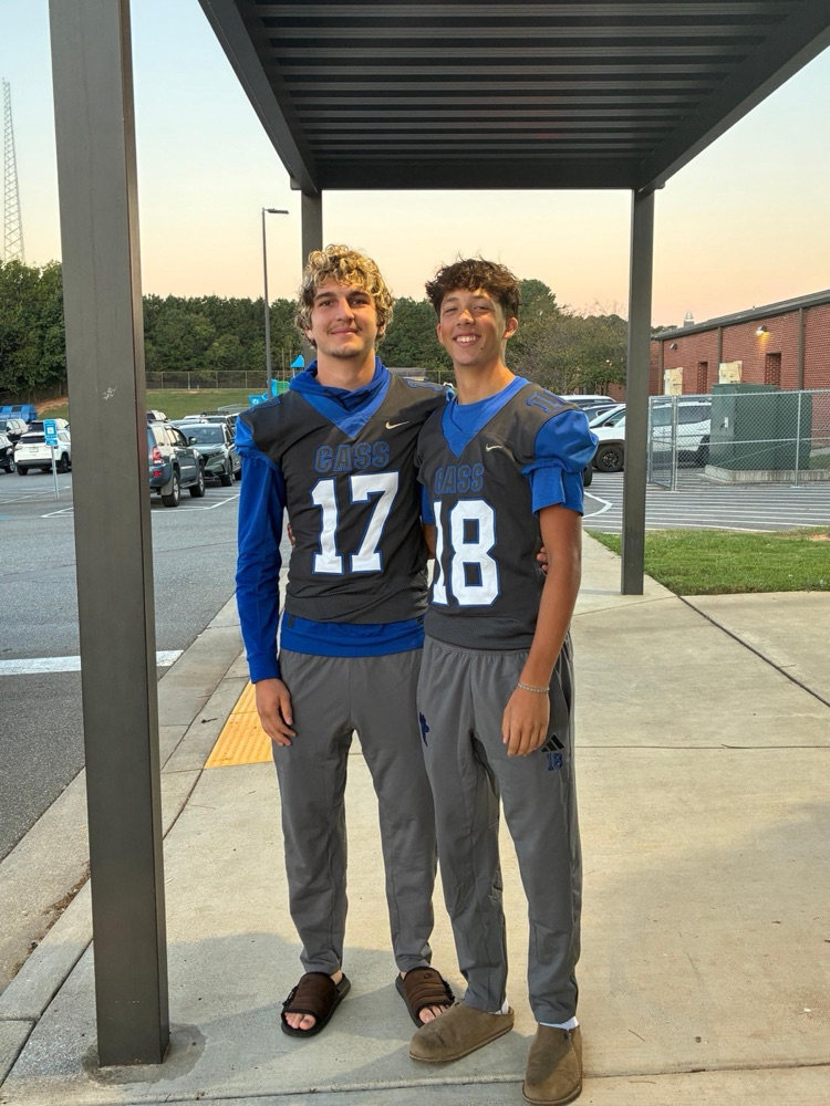 Cass High School Football players helping with car rider line this morning. 