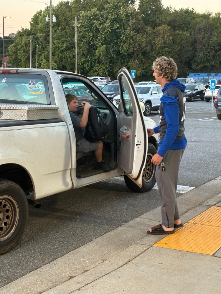 Cass High School Football players helping with car rider line this morning. 