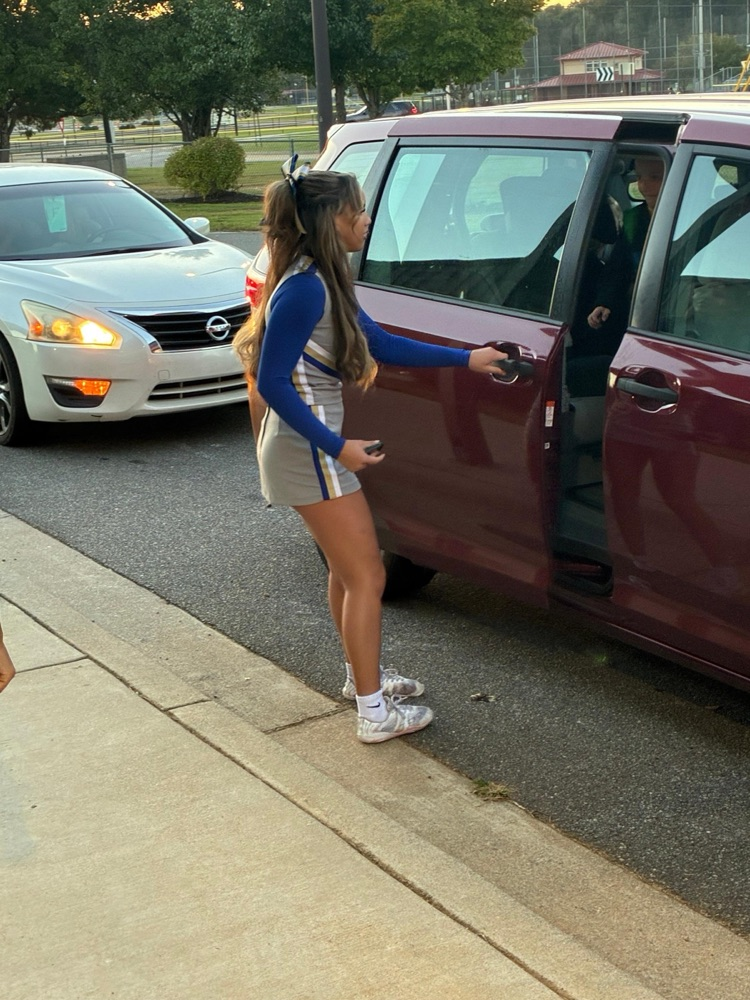 Cass High School cheerleaders helping with car rider line this morning. 