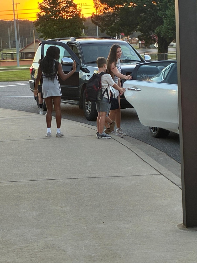 Cass High School cheerleaders helping with car rider line this morning. 