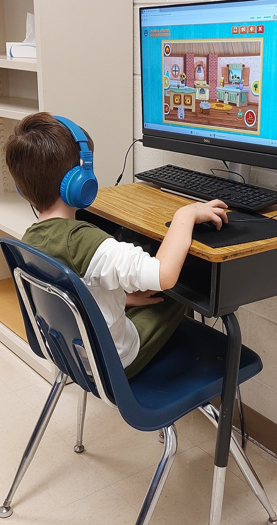 student in front of a computer