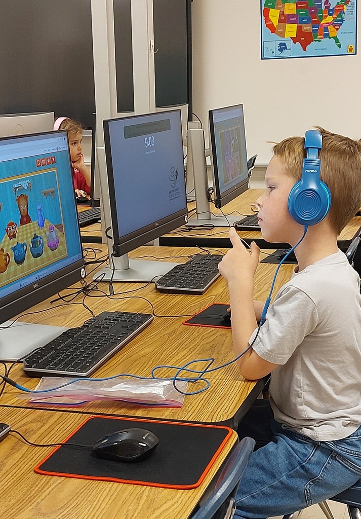 boy sitting at a computer