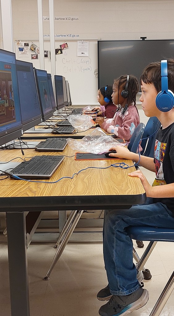 students sitting in front of computers