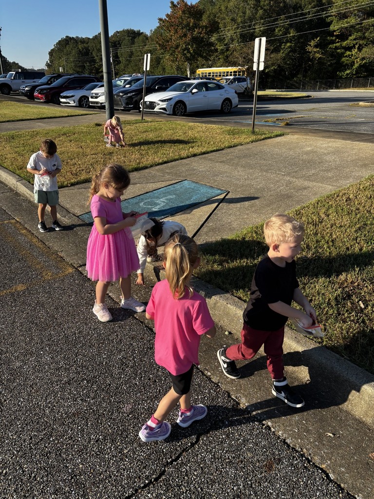 students walking outside picking up items
