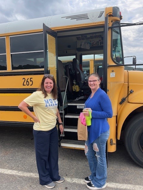 Bus driver smiling for a picture for Bus Appreciation week.