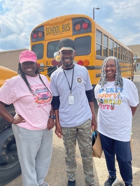 Bus driver smiling for a picture for Bus Appreciation week.