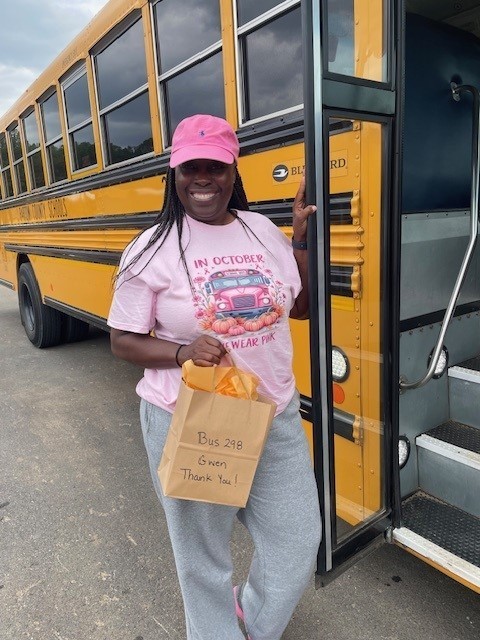 Bus driver smiling for a picture for Bus Appreciation week.