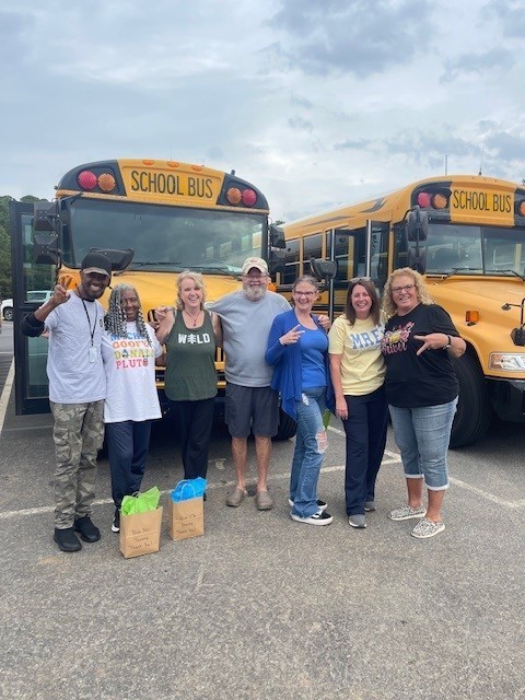 Bus driver smiling for a picture for Bus Appreciation week.