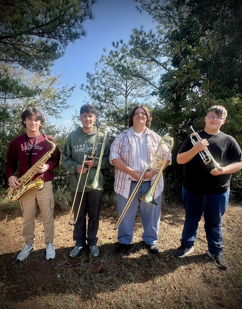 Woodland band students holding instruments