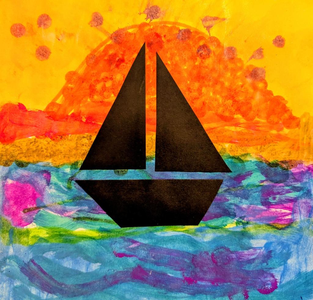 picture of a sailboat with a sunset behind it