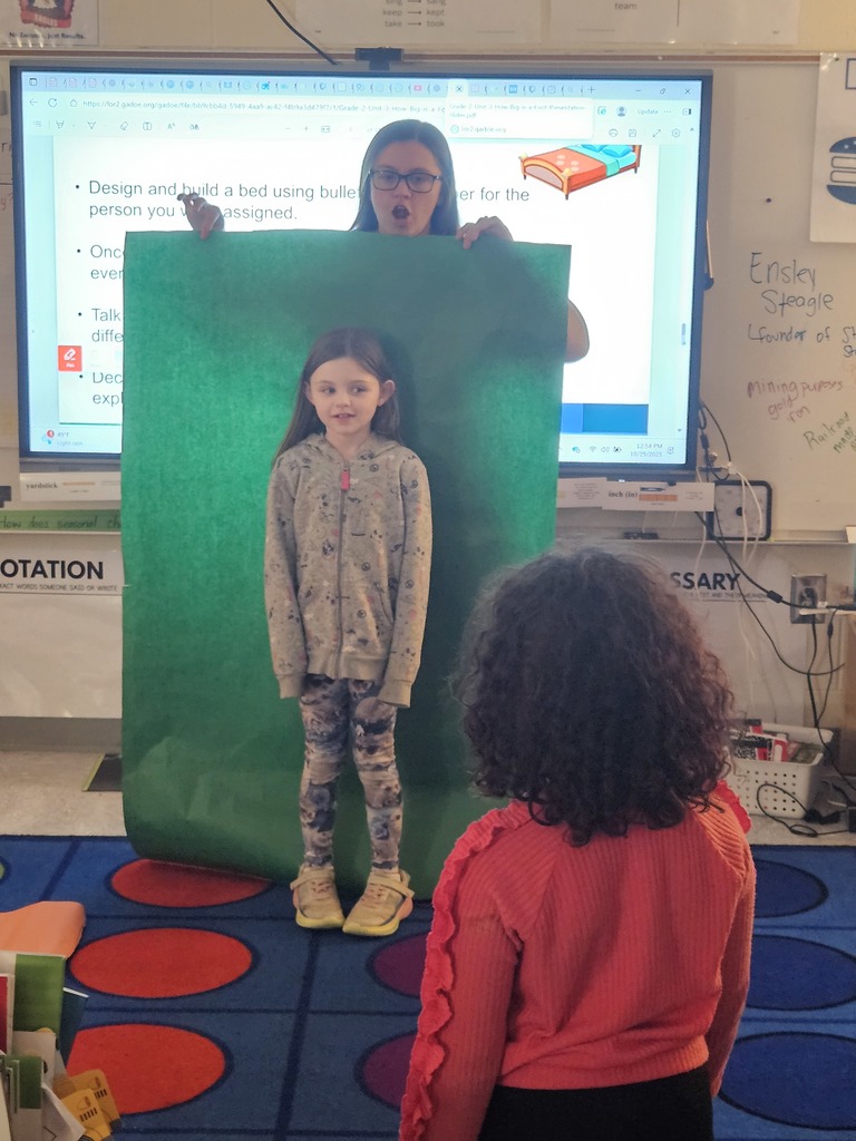 Mrs. Hill's 2nd grade had to "Build a bed" for a friend. They worked in groups on measuring a friend, measuring the paper given to them, and then making the bed the perfect size for their friend. 