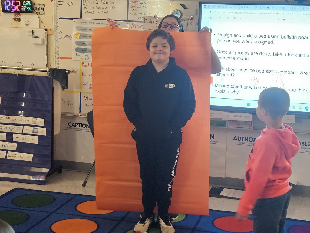 Mrs. Hill's 2nd grade had to "Build a bed" for a friend. They worked in groups on measuring a friend, measuring the paper given to them, and then making the bed the perfect size for their friend. 