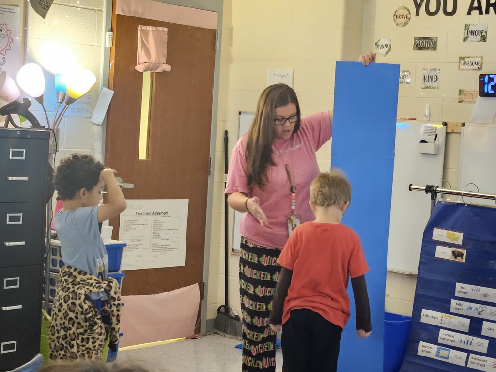 Mrs. Hill's 2nd grade had to "Build a bed" for a friend. They worked in groups on measuring a friend, measuring the paper given to them, and then making the bed the perfect size for their friend. 