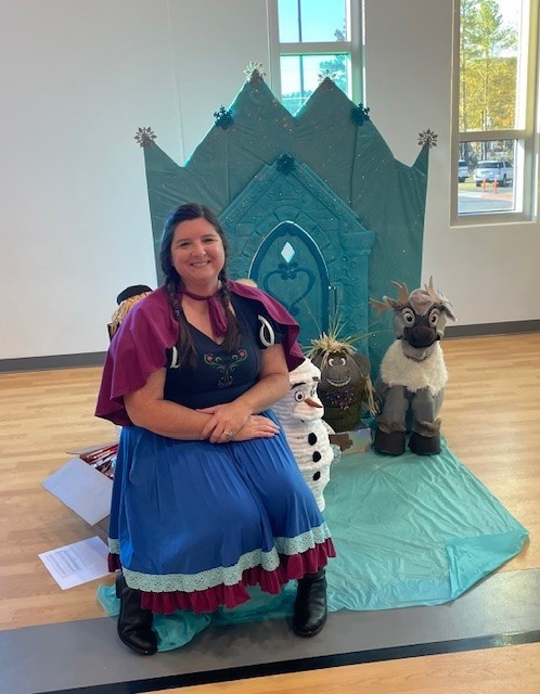 Mom smiling for a picture at our trunk or treat.