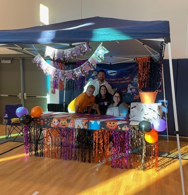 Family smiling for a picture at our trunk or treat.