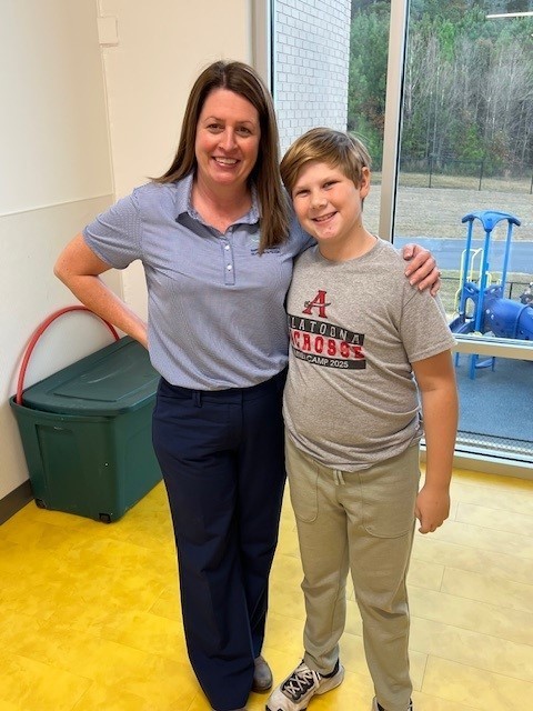 Our spelling bee winner smiling for a picture.