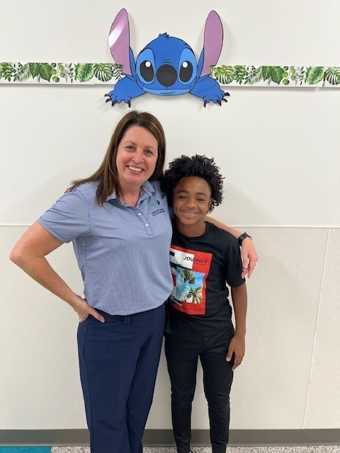 Our runner up for the spelling bee smiling for a picture.