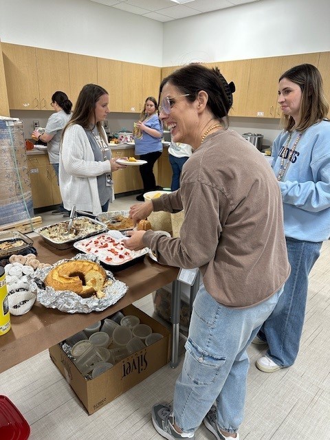Teachers getting food for lunch for Thanksgiving. 