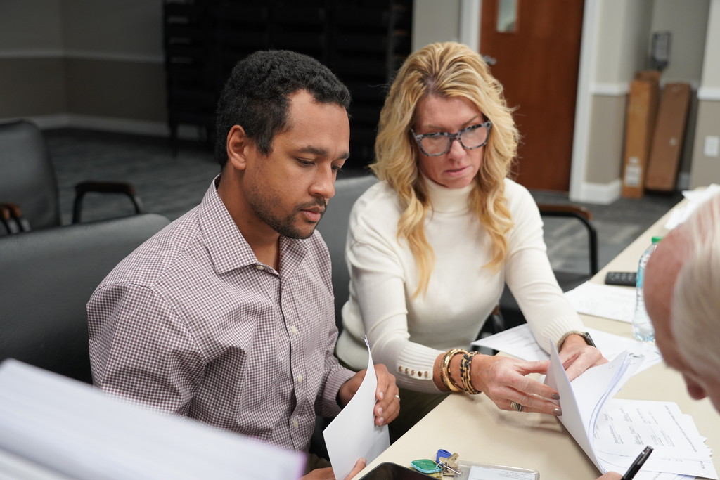 two bartow county staff members reading grants