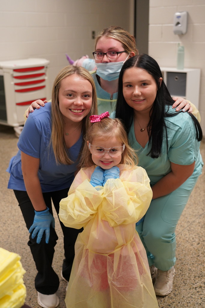 healthcare students with pre-k student
