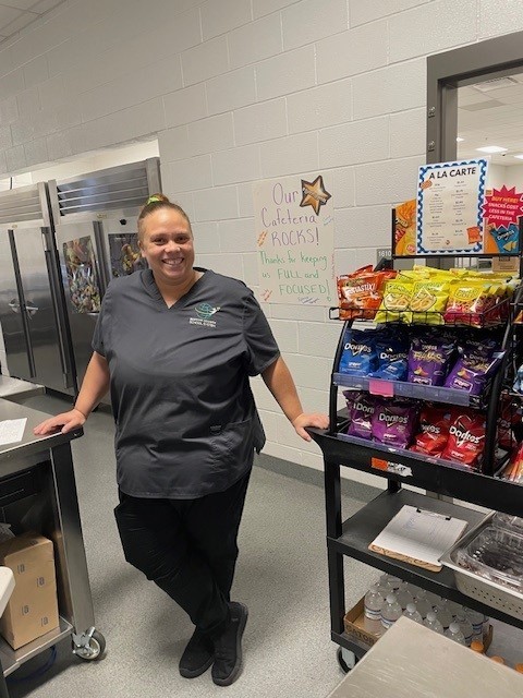Lunch staff smiling for a  picture.