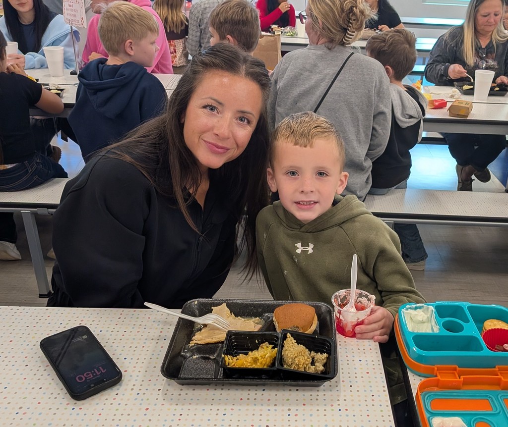 Mother and son smiling for a picture during our thanksgiving lunch. 