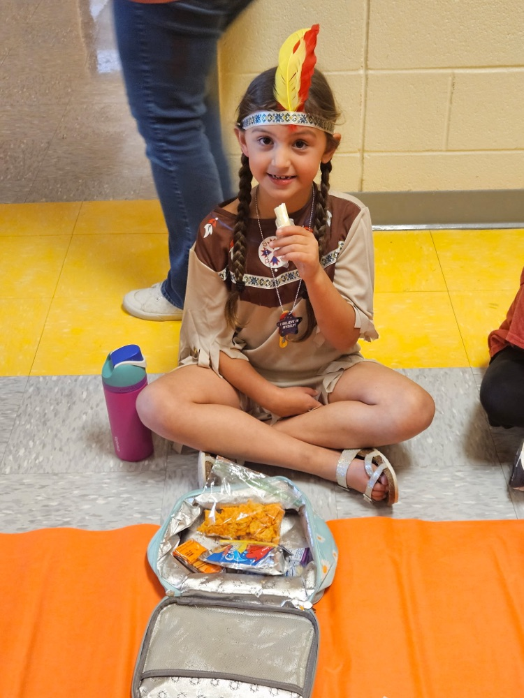 Second grade had a thanksgiving lunch in the hallway. They have been learning about Native Americans and today they got to dress like them and feast like them! 