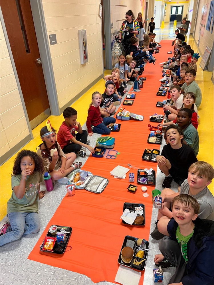 Second grade had a thanksgiving lunch in the hallway. They have been learning about Native Americans and today they got to dress like them and feast like them! 