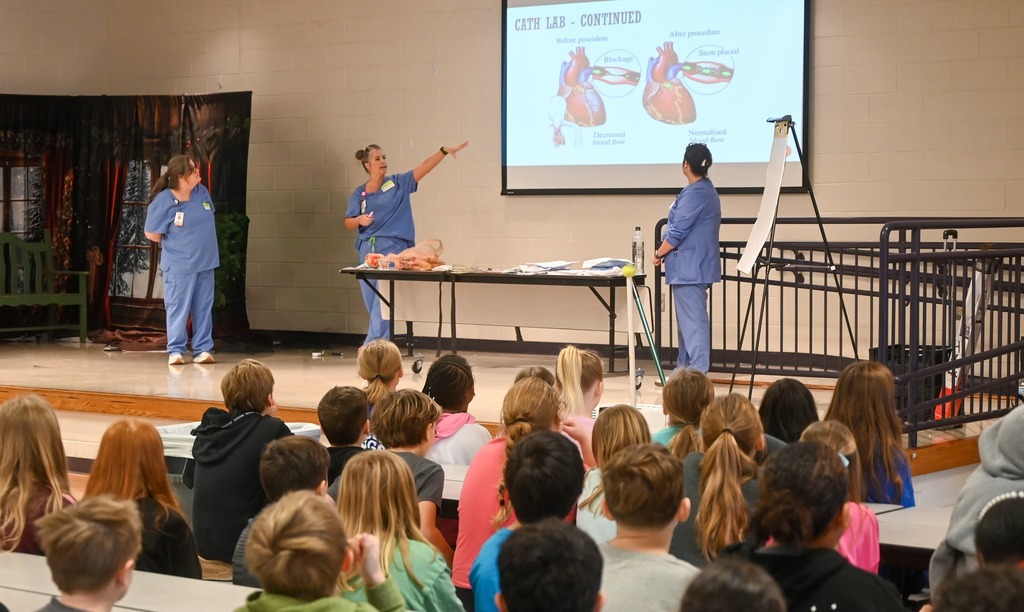 nurses teaching students in a cafeteria