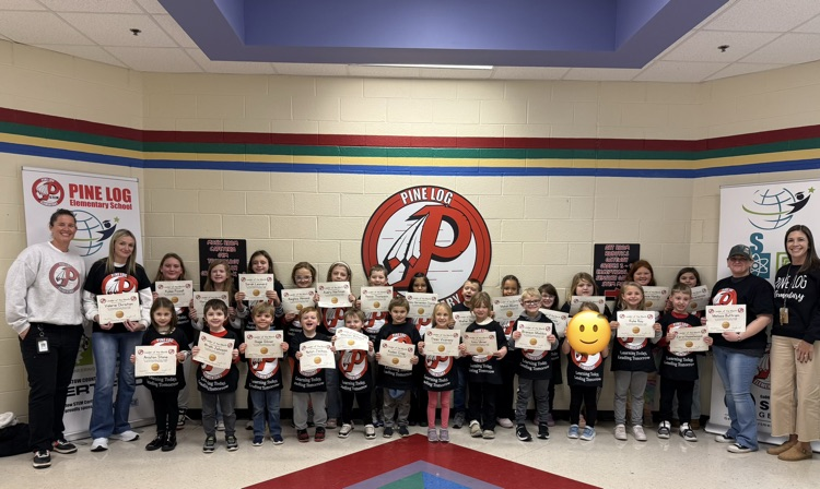 group of people holding certificates and wearing black shirts
