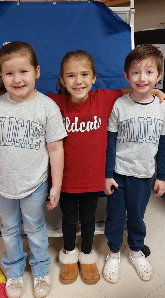 two girls and a boy with wildcat shirts on
