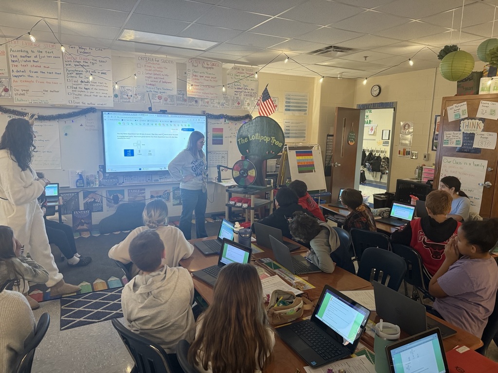Congratulations to Ms. Taylor's and Mrs. Bennett's class for spelling Perfect Attendance! Ms. Taylor's class spun the wheel and won a free bread party, and Ms. Bennett's class won the lollipop tree!