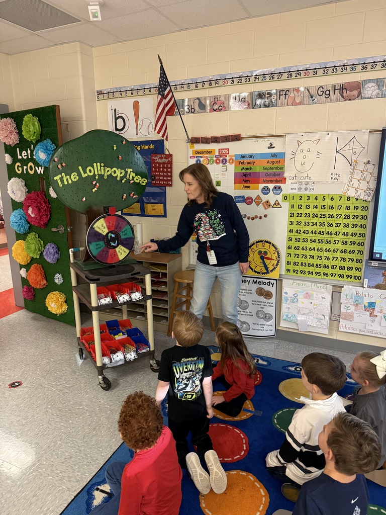 Congratulations to Ms. Taylor's and Mrs. Bennett's class for spelling Perfect Attendance! Ms. Taylor's class spun the wheel and won a free bread party, and Ms. Bennett's class won the lollipop tree!