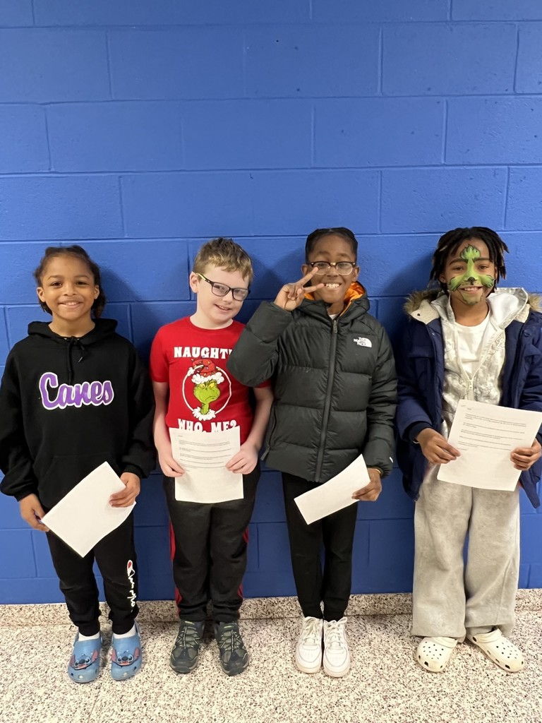 4 students holding certificates
