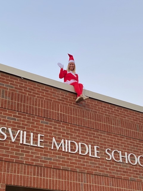 Sarah Callaway sitting on roof of school