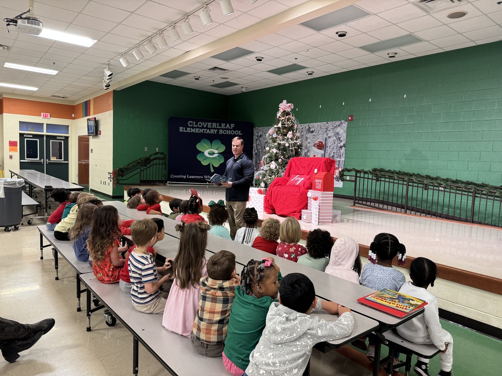 Superintendent Terza reading to pre-K students at a school