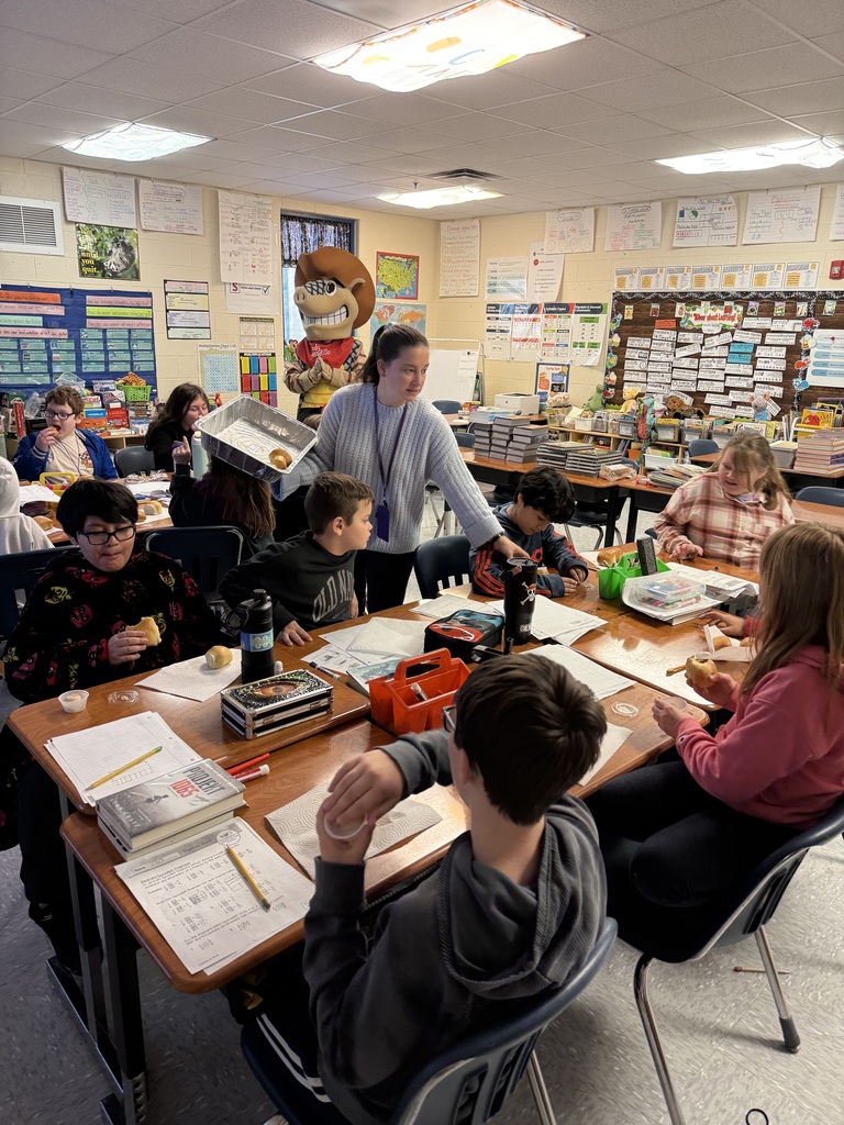 Ms. McAllister's and Ms. Taylor's class got to have their Perfect Attendance Texas Roadhouse bread party today with Andy the Armadillo!